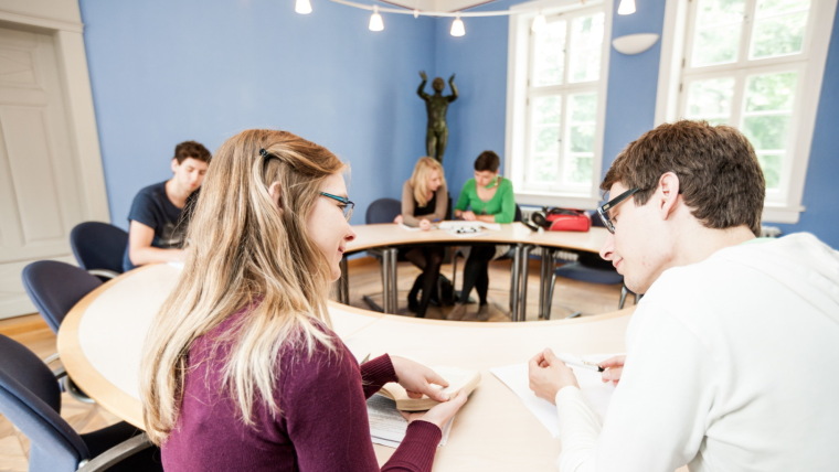 Two persons discussing with each other